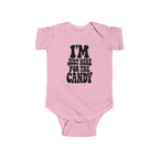 Pink baby bodysuit with "I'm just here for the candy" graphic on the front