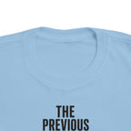 Toddler short-sleeve T-shirt, light blue, "THE PREVIOUS" text graphic