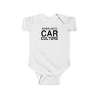 White baby bodysuit with short sleeves and front “Born Into Car Culture” graphic