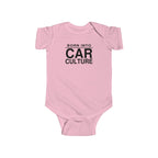 Pink baby bodysuit with short sleeves and front “Born Into Car Culture” graphic