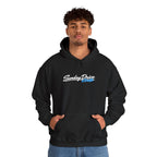 Black pullover hoodie worn by model, embroidered chest logo and drawstring hood