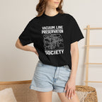 Black t-shirt with front Vacuum Line Preservation Society graphic on a woman