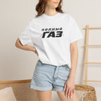 White crew-neck T-shirt with front logo print, worn with blue denim shorts