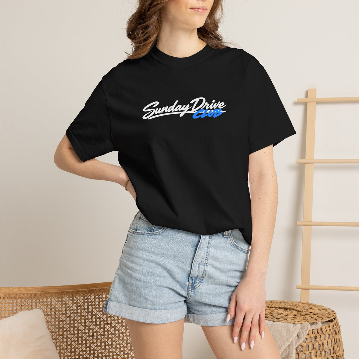 Black T-shirt on model with “Sunday Drive Club” logo print