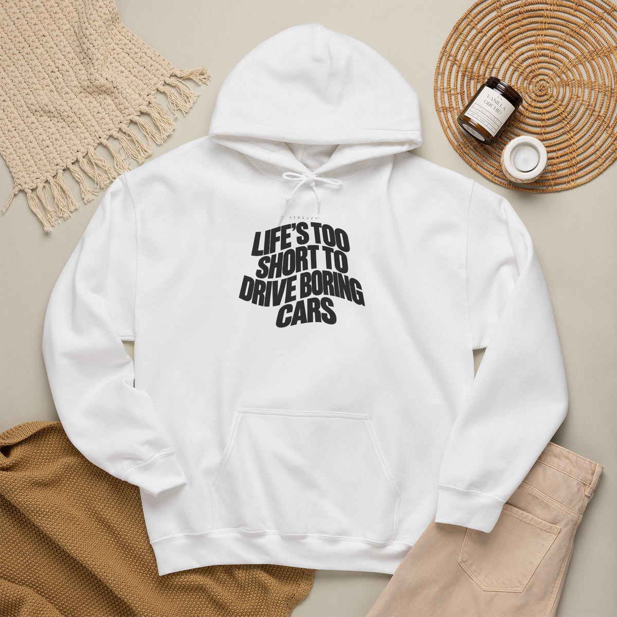 White hoodie worn with hood and front slogan graphic.