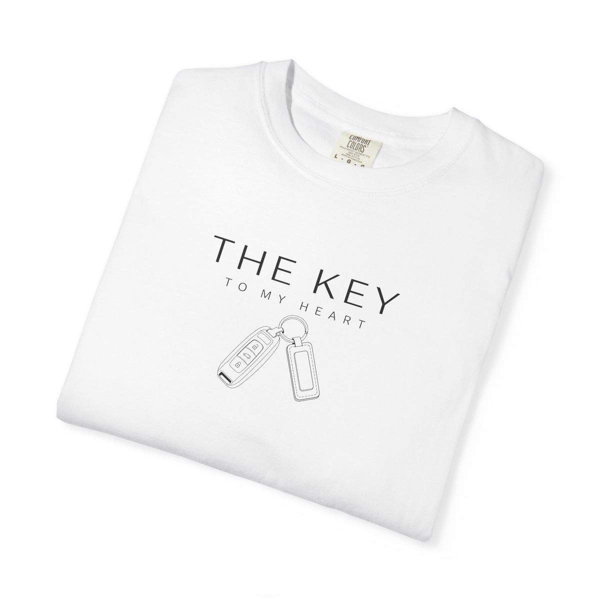 White crew-neck T-shirt with 'THE KEY TO MY HEART' and key graphic.