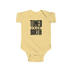 Butter yellow baby bodysuit with short sleeves and “TUNED FROM BIRTH” front graphic