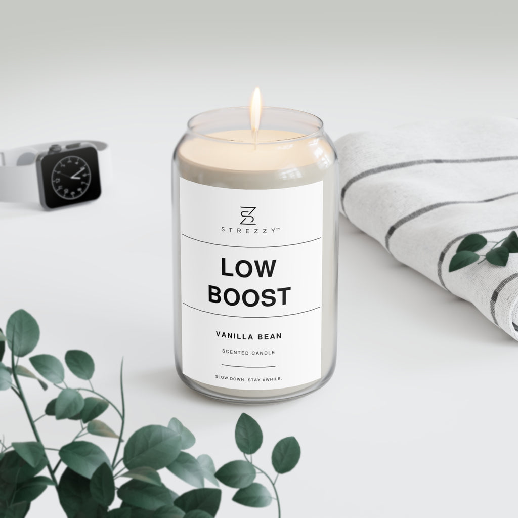 Soy candle in clear jar with flame and Low Boost Vanilla Bean label