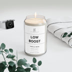 Soy candle in clear jar with flame and Low Boost Vanilla Bean label