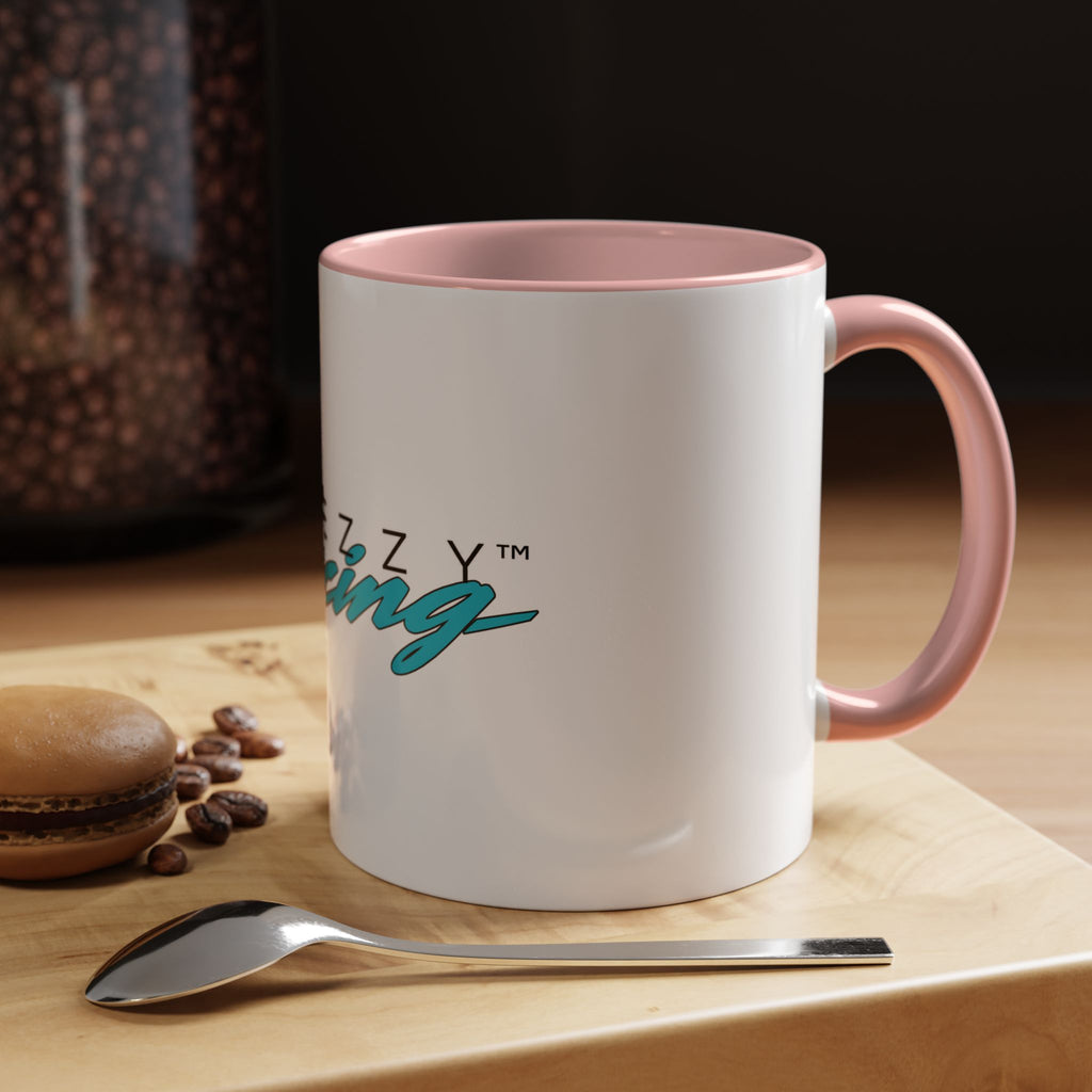 White mug with pink lid and handle; “Racing” logo visible on the front
