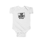 White baby bodysuit with short sleeves and “Top Secret Co-pilot” chest graphic