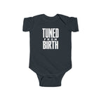 Black baby bodysuit with short sleeves and “TUNED FROM BIRTH” front graphic