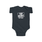 Black baby bodysuit with short sleeves and “Top Secret Co-pilot” chest graphic