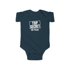 Navy baby bodysuit with short sleeves and “Top Secret Co-pilot” chest graphic