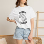 White T-shirt with front 'Fueled by Tradition' engine graphic worn with denim shorts